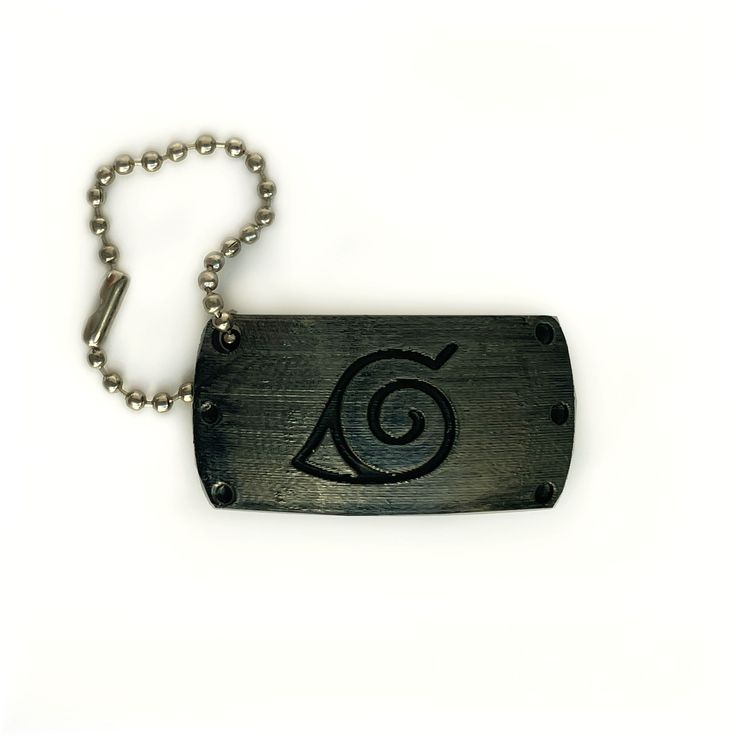 a metal tag with an eye on it and a ball chain hanging from the end