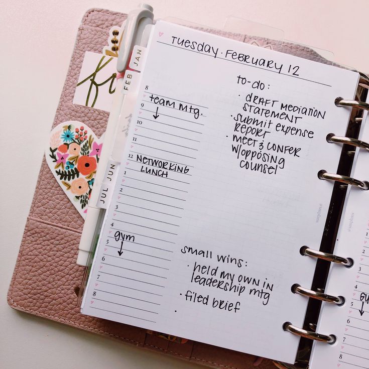 an open planner book with writing on it