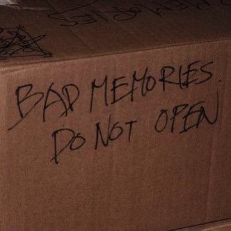 a cardboard box with graffiti written on it and the words bad memories don't open