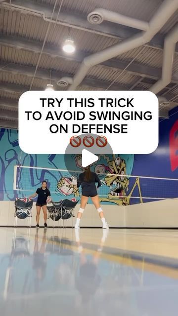 two girls are playing volleyball in an indoor court with the words try this trick to avoid swinging on defense