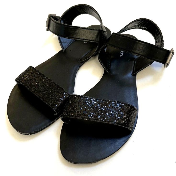 Beautiful Xhilaration Sandals. Heel Height - 0-1" Slip-On Sandal Slide Glitter Upper Design Memory Foam Foot Bed For Comfort Shoe Width - Medium Rubber Spot Clean Measurements: Heel Height: 12 In Weight: 15 Oz New Without Box. Impeccable Condition. Size: 7 Color: Black (Sparkling) Item Comes From A Smoke & Pet Free Home. Sequin Open Toe Sandals For Night Out, Glamorous Glitter Sandals For Beach, Glamorous Glitter Beach Sandals, Black Sparkling Open Toe Sandals, Adjustable Glitter Sandals With Round Toe, Adjustable Glitter Sandals For Summer, Summer Adjustable Glitter Sandals, Adjustable Glitter Sandals, Glamorous Black Glitter Sandals