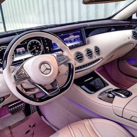 the interior of a mercedes benz s - class coupe with pink leather seats and dashboard