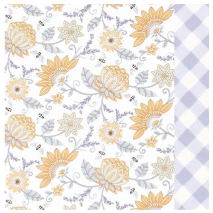 a white and yellow floral pattern with gingham checkered tablecloth on it