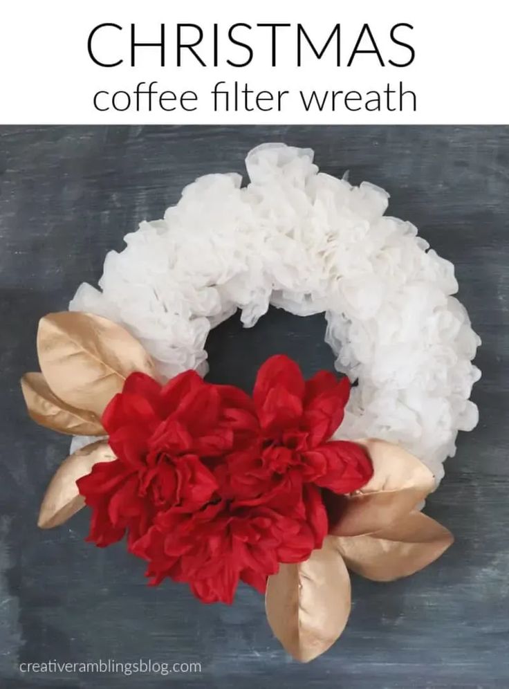 a coffee filter wreath with red and white flowers