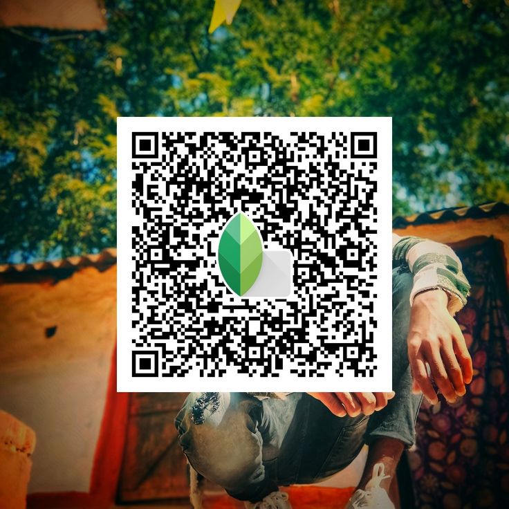 a person sitting on top of a wooden bench next to a tree and qr code