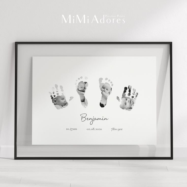 a black and white photo with three baby's handprints in the frame