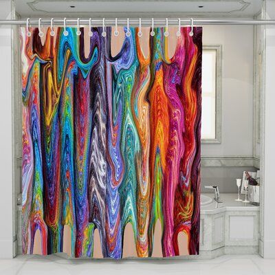 the shower curtain is decorated with multicolored marbles