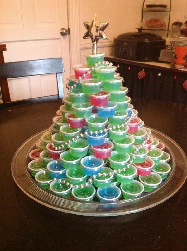 a christmas tree made out of cups on top of a tray with the words, i'm'm's tree this year with ten soda and 4 others