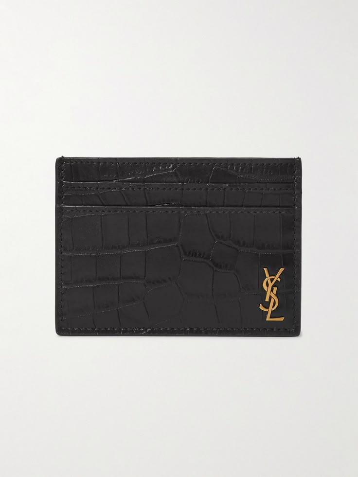 Though slim, SAINT LAURENT's cardholder has enough room to hold receipts, folded notes and a few cards. It's made from glossy croc-effect leather and features the label's 'YSL' plaque at the corner. Designer Card Holder Wallet, Designer Card Holder, Luxury Card Holder, Ysl Star Card Holder, Luxury Designer Men's Card Holder, Classic Black Luxury Card Holder, Ysl Card Holder, Designer Luxury Black Card Holder, Saint Laurent Card Holder