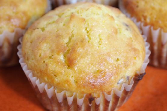 several muffins sitting on top of an orange table