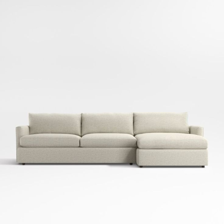 a white couch with a chaise lounge on it