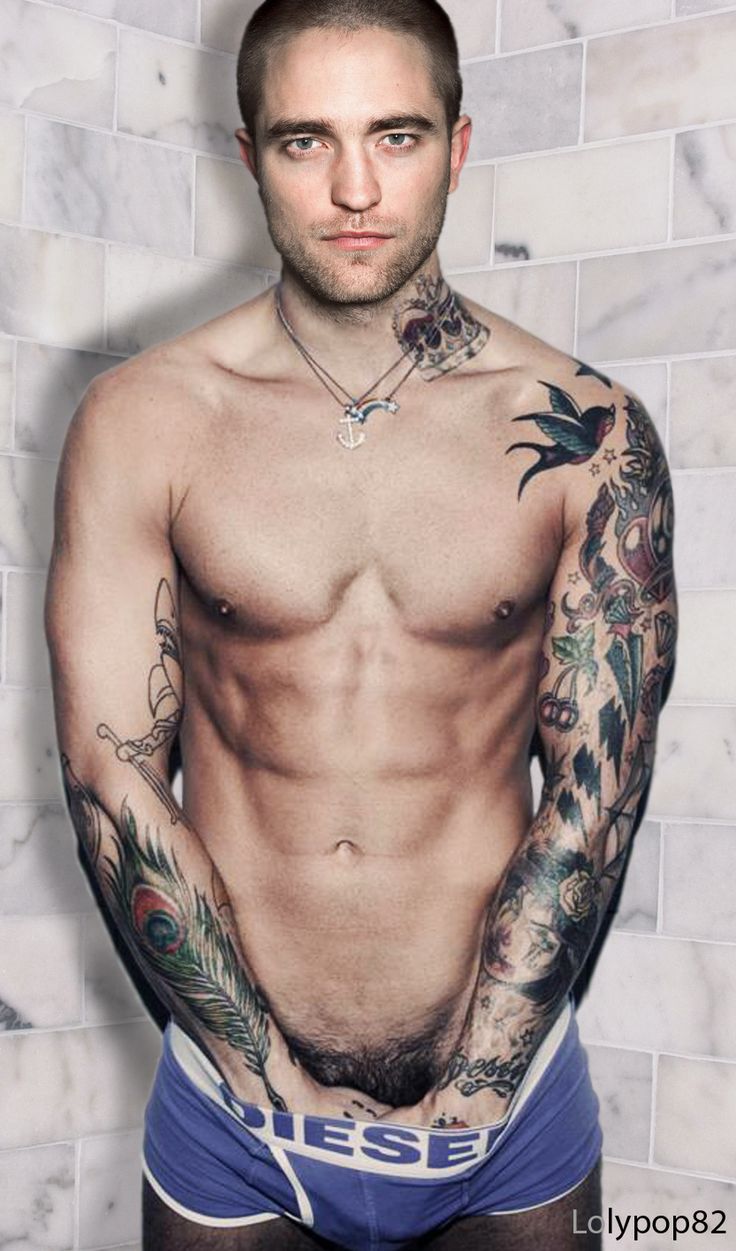 a shirtless man with tattoos on his arms and chest standing in front of a white wall