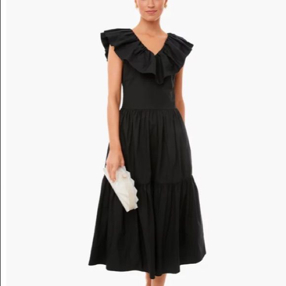 Nwot The Black Ruffle Jo Dress Features A V-Neckline With Flutter Sleeves And A Tiered A-Line Skirt. Breezy And Feminine, This Style Is Versatile For Everything From Picnics In The Park To Special Occasions. Add Wedges And Statement Earrings For An Extra Pop Of Color! V-Neckline Flutter Sleeves Midi Length Tiered A-Line Skirt Material: 100% Cotton Care: Hand Wash Cold Water, Lay Flat To Dry **Authentic Pomander Place From Tuckernuck** Tuckernuck Dress, Black Ruffle, Dresses Black, Flutter Sleeves, A Line Skirt, Flutter Sleeve, A Line Skirts, The Park, Midi Length