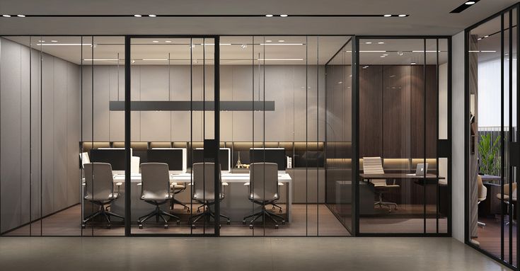 an office with glass walls and chairs around the desks in front of each other