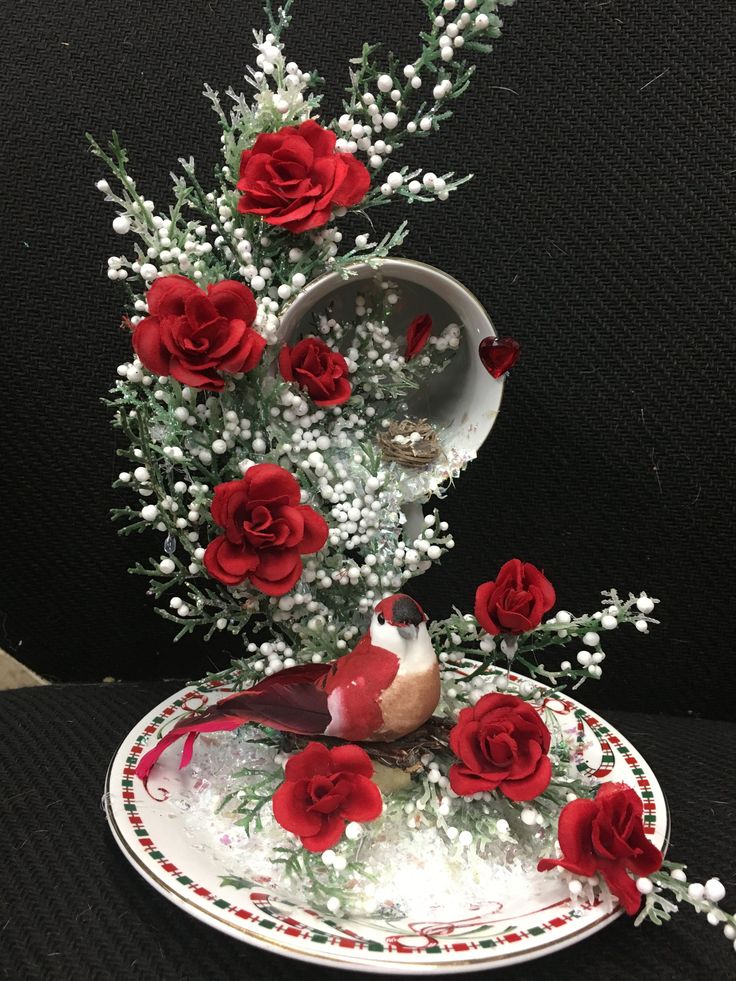 red roses and baby's breath are arranged on a plate