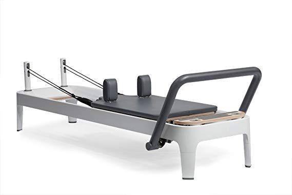 an exercise bench with two benches attached to the back and side rails on each side