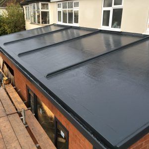 a flat roof is being installed on a house