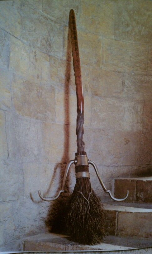 a broom sitting on top of a stone floor