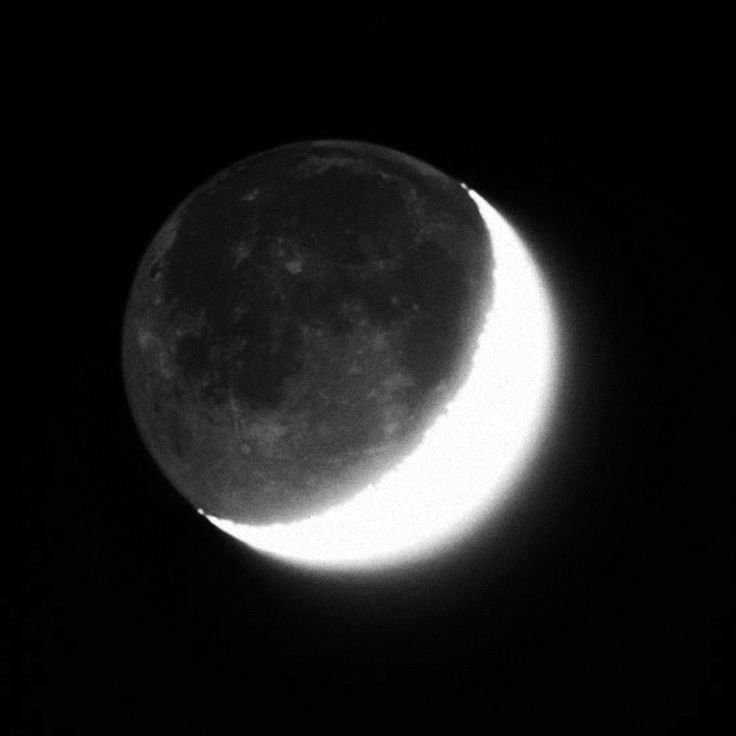 the moon is shown in black and white