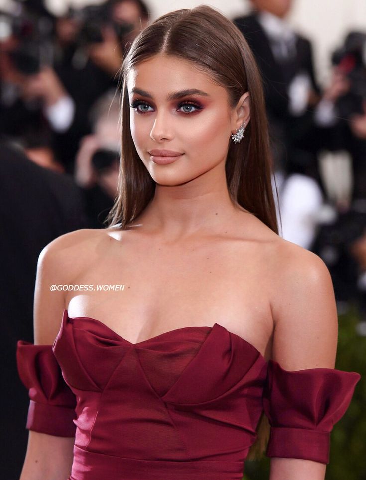 an image of a woman in a red dress at the mete galas event