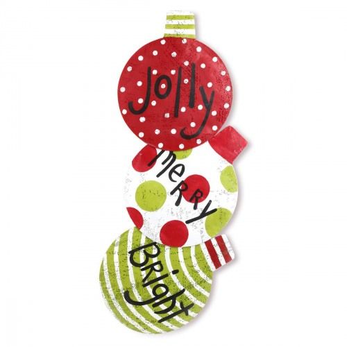 a christmas ornament hanging from the side of a white wall with polka dots on it