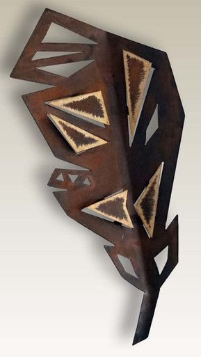 an abstract sculpture made out of metal and wood with geometric shapes on the sides, including triangulars