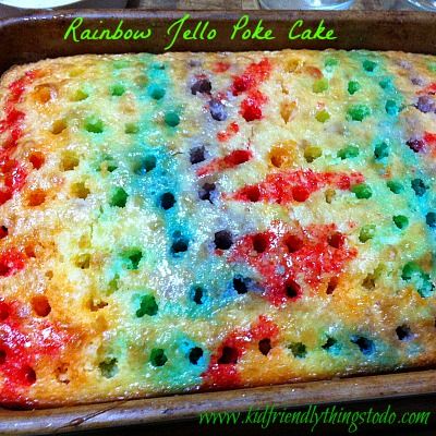 rainbow jello poke cake in a baking pan