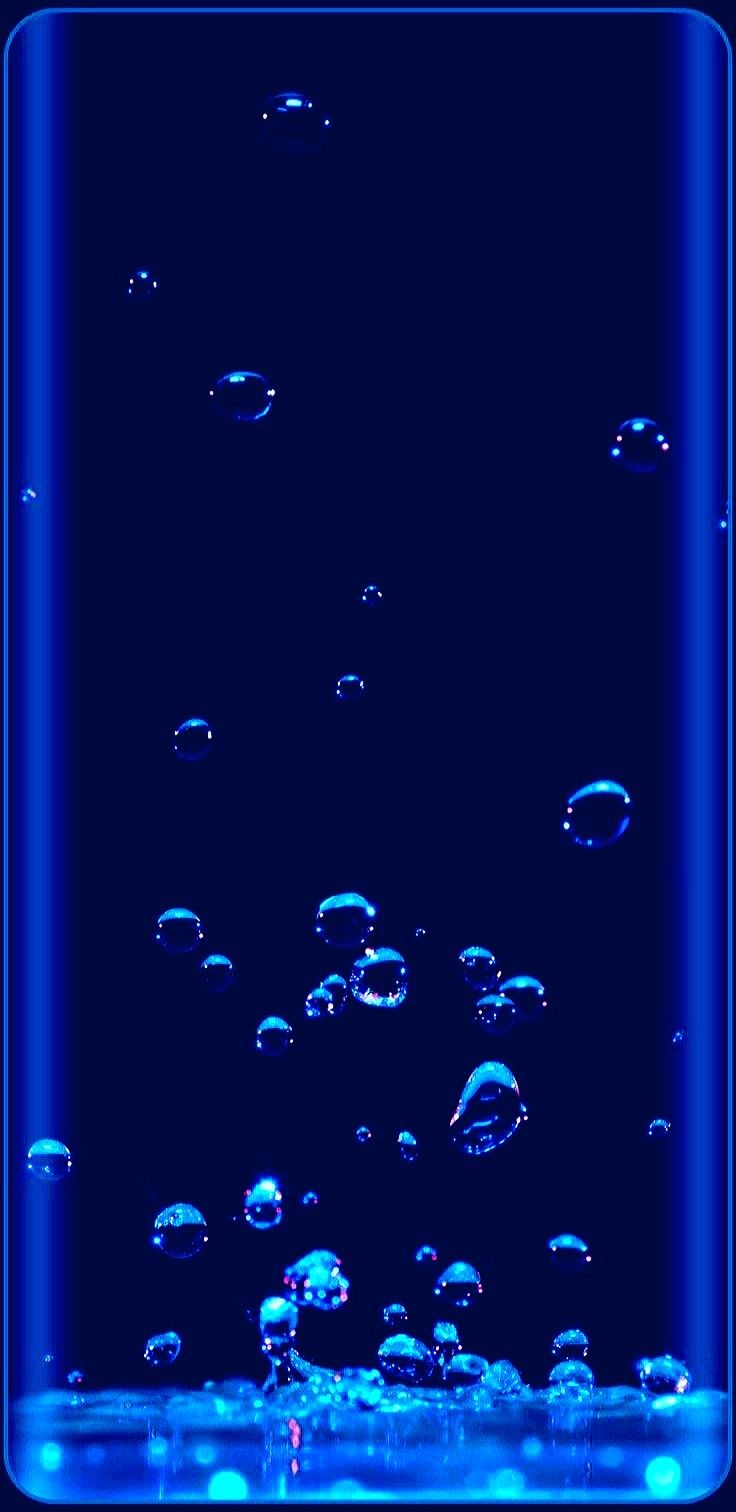 blue water bubbles floating in the air