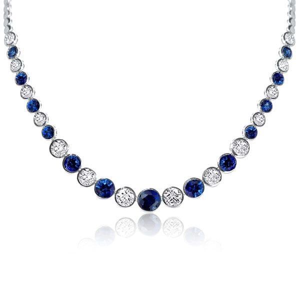 This 12.98 CT. TW Classic Blue & White Bezel Round Tennis Necklace is a stunning piece of jewelry for women. Crafted with precision and care, it features a beautiful combination of blue and white round-cut stones in a bezel setting. This timeless necklace is perfect for any occasion and will add a touch of elegance to any outfit. 🔴 Necklace Information 🔴 Metal:925 Sterling Silver Total Weight:18.20 g Chain Length:17'', 18'' Rhodium:Yes. Give Platinum appearance Nickel Free:Yes 🔴 Gem Information 🔴 Gem Type:Sapphire Stone Color:Blue & White Carat Stone Weight:12.98 CT.TW. Stone Cut:Round Stone Setting:Bezel *All stone weights (CT.) are approximate and listed as diamond equivalent weight in carats. Also total weight of the ring, ring band width & thickness may have a slight deviation no m Timeless Necklace, Show Beauty, Art Deco Pendant, Stone Setting, Tennis Necklace, Sapphire Stone, Stone Cuts, Ring Band, Ring Ring