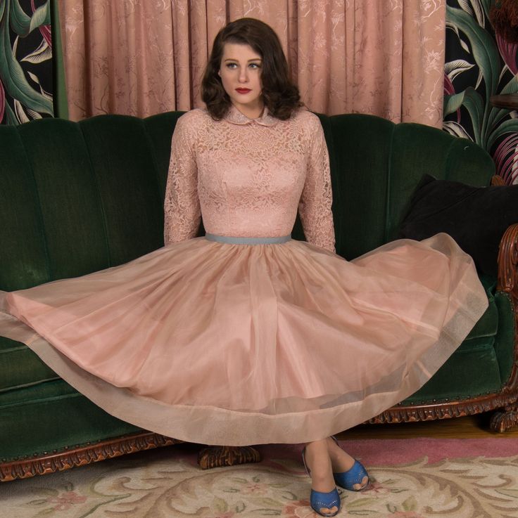 "Vintage 1950s party dress is sublime for spring, a layered confection that is a little flirty and a little formal. The lining is made up of a crisp, lustrous, rosy pink acetate, with a sweetheart bust and full, sweeping skirt. The exterior bodice, in contrast, is a match lace - still sturdy and crisp - with a high neck and full length fitted sleeves. The   skirt is layered with a crisp, breath beige-pink organza that just floats. The collar and cuffs and combine are covered with the same material, which gives the pink a sort of shimmer. They are embellished with coils of soutache and studded in rhinestones and beads. The dress closes up the back with a sturdy metal zipper  ✂-----Measurements Bust: 36\" Waist: 25\" Hips: 47\" Length: 47\" Bodice: 17.25 Label: None Present Material: Acetate 1950s Style Fitted Party Petticoat, Feminine Dresses For Spring Vintage Events, Fitted Spring Evening Petticoat, Feminine Spring Petticoat For Party, Fitted Evening Petticoat For Spring, Feminine Spring Party Petticoat, Elegant Evening Spring Petticoat, Fitted Petticoat For Spring Evenings, Elegant Pink Party Petticoat