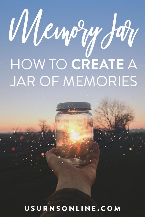 someone holding up a jar with the words memory jar how to create a jar of memories