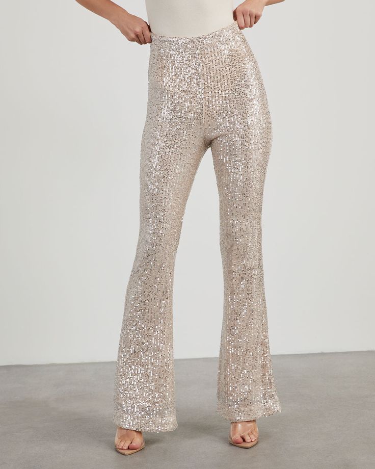 Bring glitz and glamour to your nightlife with the Diva Sequin Flare Pants! Made from shiny sequin fabric, these pants sit high with a fitted waist, straight leg fit and side zipper closure. Pair it with a neutral top or the matching Diva Sequin Bubble Hem Top. Fitted waist – non-stretch Straight leg fit Side zipper, hook & eye closure Sequin fabric with lining Shell: 100% Polyester, Lining: 80% Polyester 20% Cotton Flare Sequin Pants, Sequence Pants, Diamond Pants, Sparkly Pants, Sequin Flare Pants, Sheer Pants, Elephant Pants, Neutral Tops, Glitz And Glamour