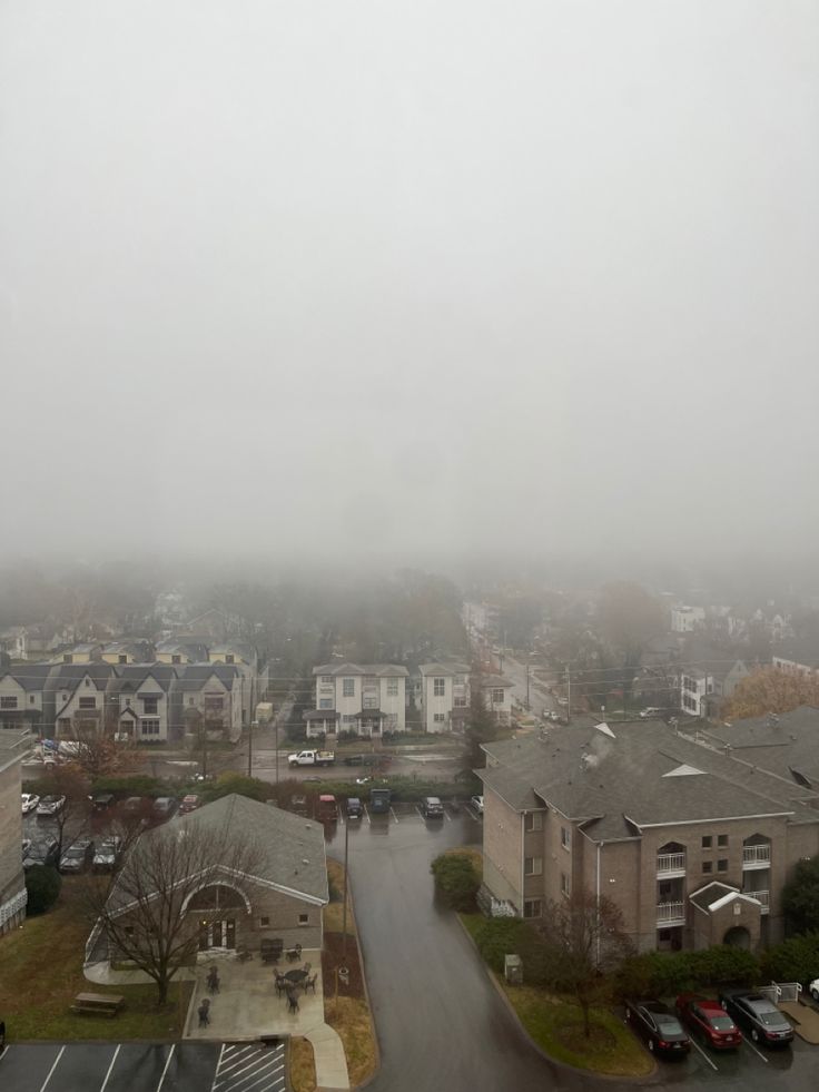 an aerial view of a city in the fog