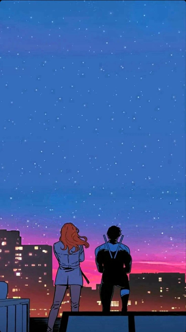 two people standing on top of a roof looking up at the stars in the sky