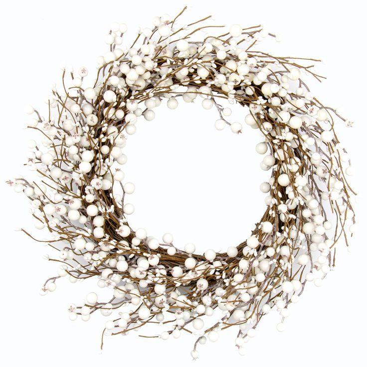 a close up of a wreath made out of white balls and twigs on a white background