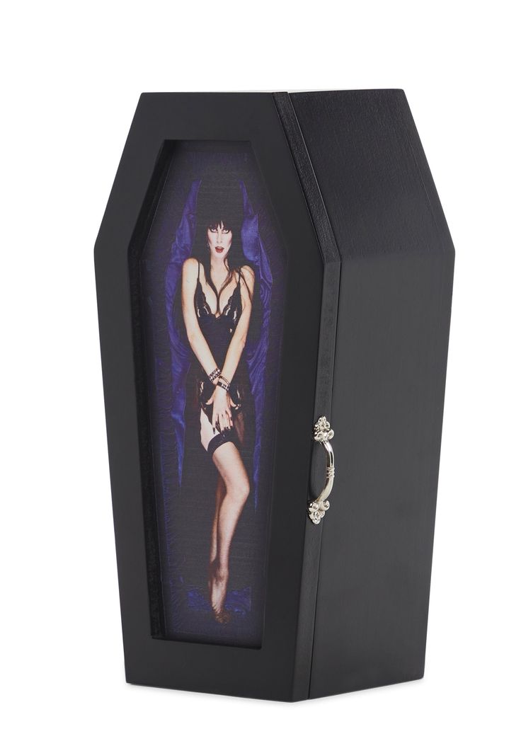 Let the mistress of the dark take care of your valuables in this coffin shaped jewelry box that has a crushed velvet interior, an Elvira graphic on the front, a mirror, and a silver handle. Velvet Interior, Velvet Interiors, Novelty Bags, Black Mirror, Love Necklace, Crushed Velvet, Goth Fashion, Bags Accessories, Dolls Kill