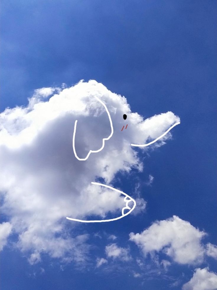 an elephant drawn in the sky on a sunny day with blue skies and white clouds