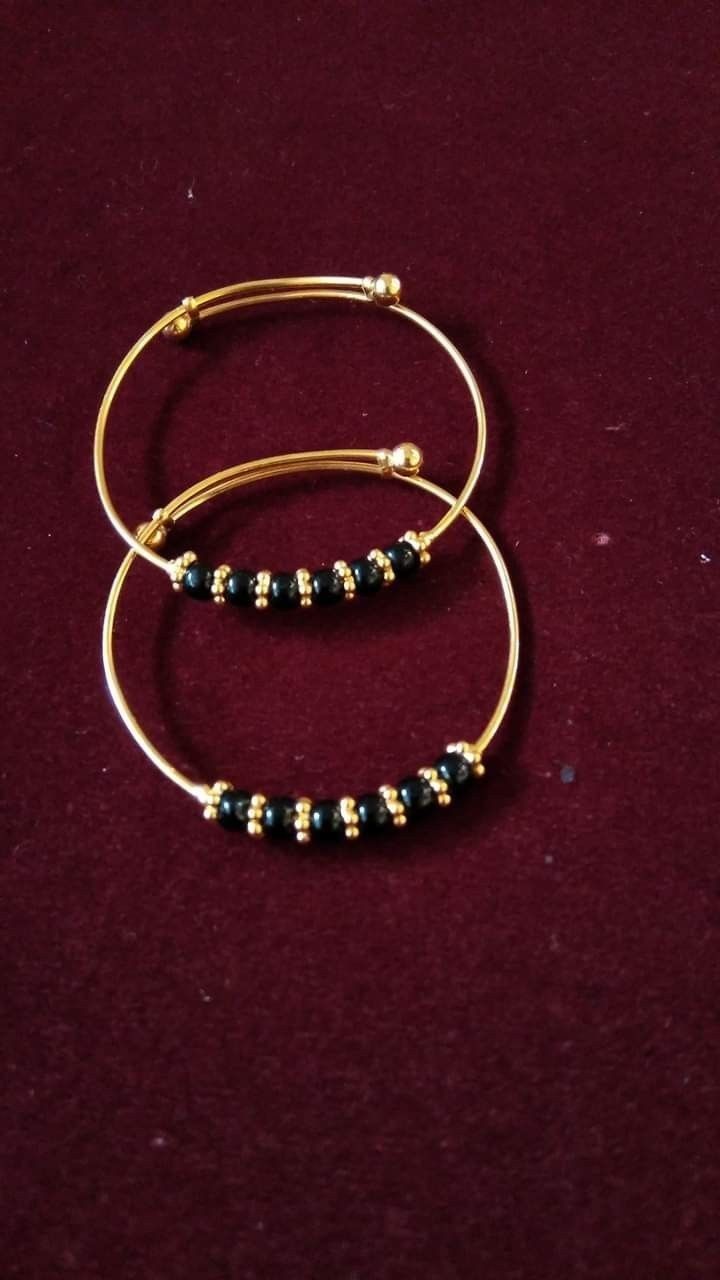 Gold baby bangles designs Baby Jewelry Gold, Kids Gold Jewelry, New Gold Jewellery Designs, Baby Bangles, Beautiful Gold Necklaces, Gold Mangalsutra Designs, Gold Bridal Jewellery Sets, Black Beaded Bracelets, Antique Bridal Jewelry