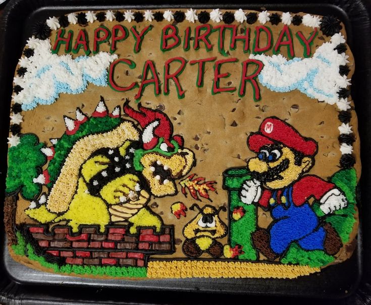 an image of a birthday cake with mario and super mario bros on it's side