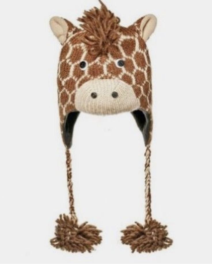 a knitted hat with a giraffe's head on top of it