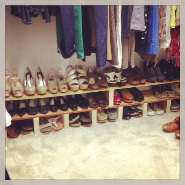 there are many pairs of shoes on the shelf