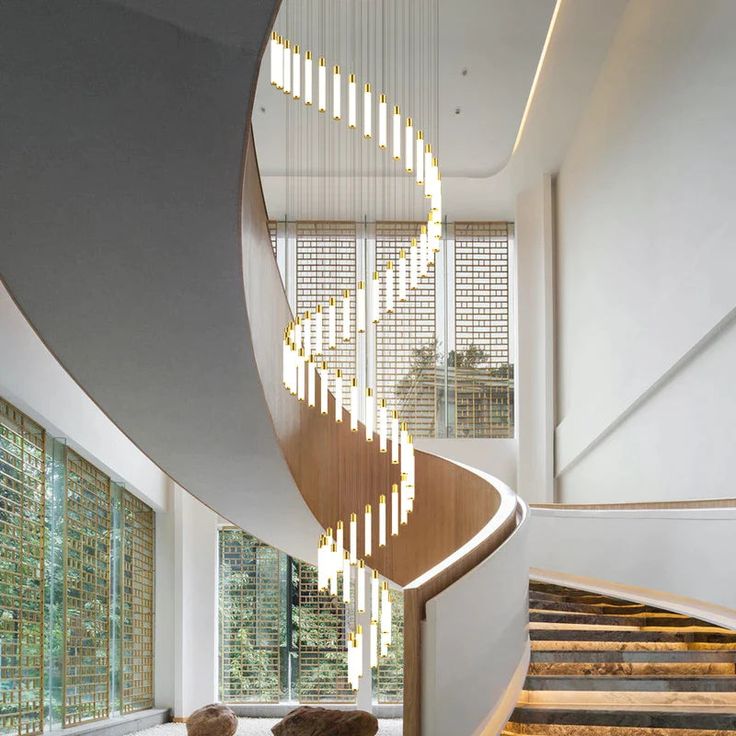 a spiral staircase in the middle of a living room