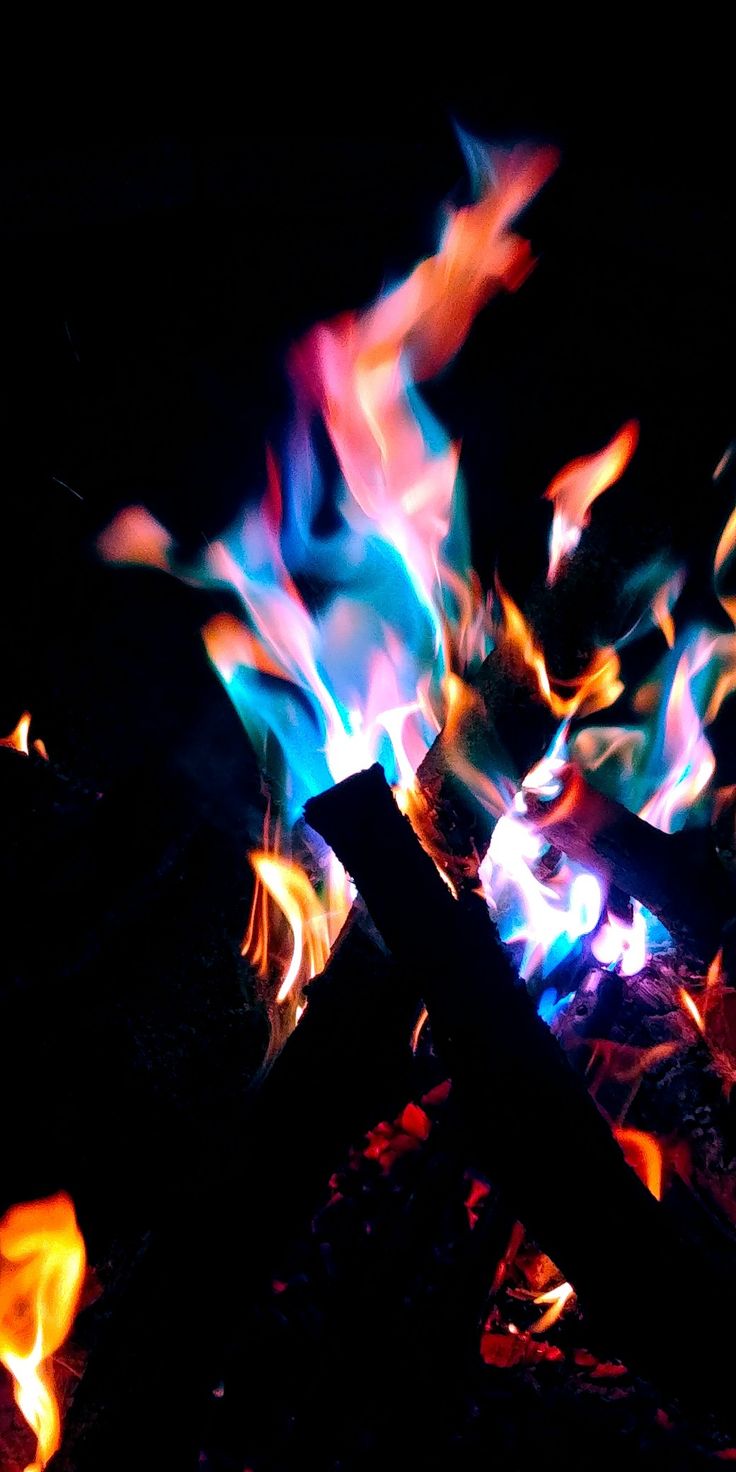 the fire is glowing brightly in the dark