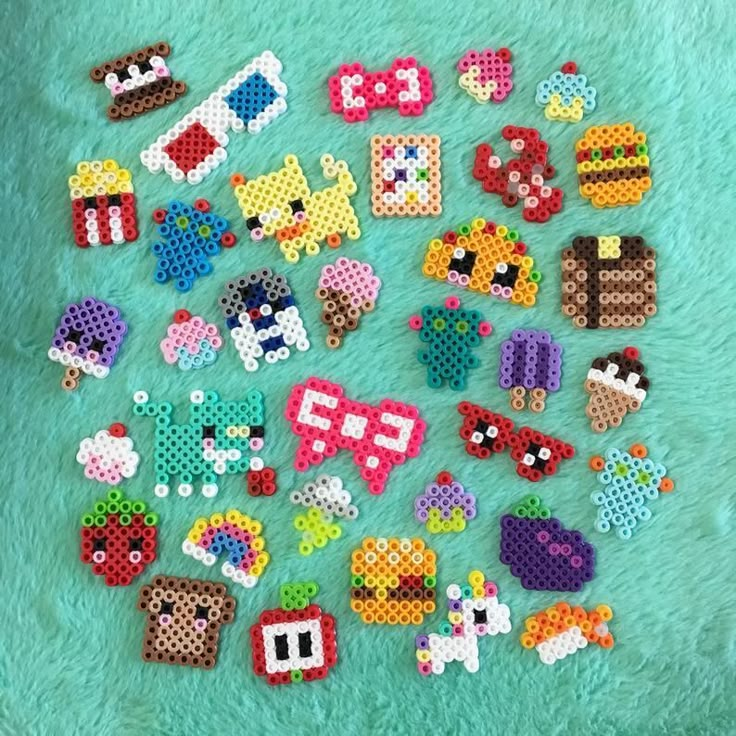 a bunch of pixelated objects are laying on a blanket