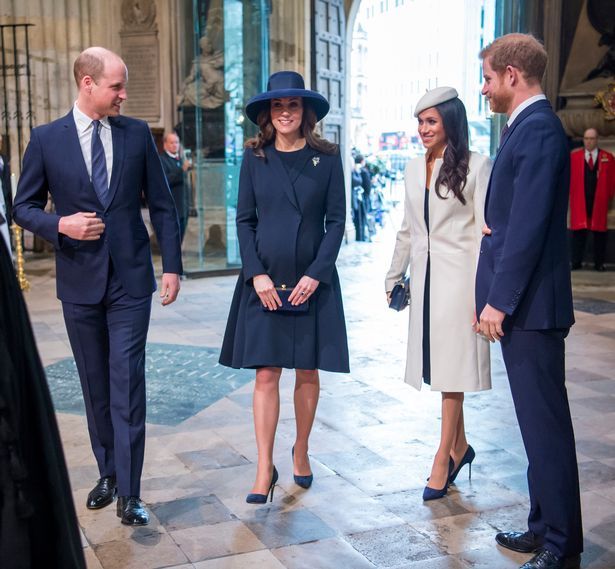 the duke and princess of cambridge are talking to two men in business suits, one wearing a hat