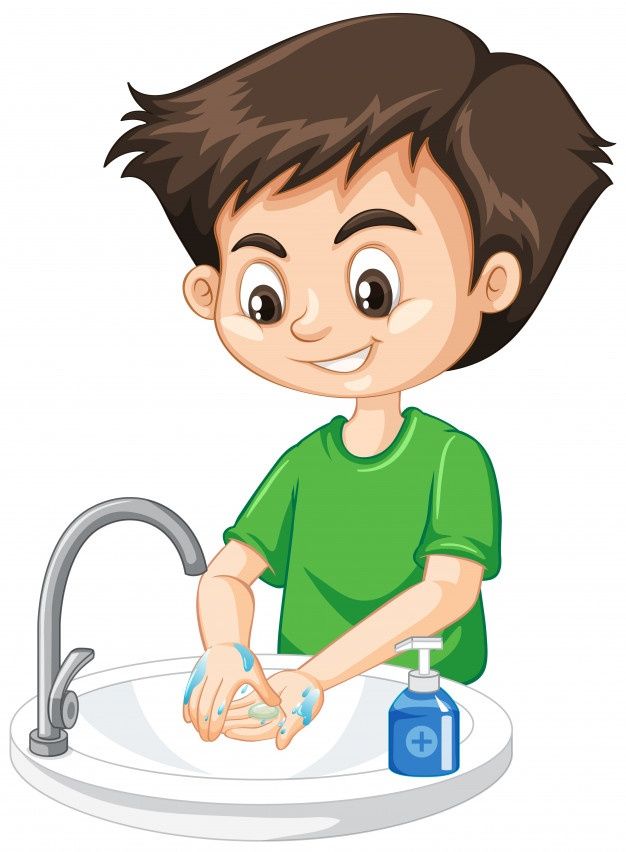 a boy washing his hands in the sink