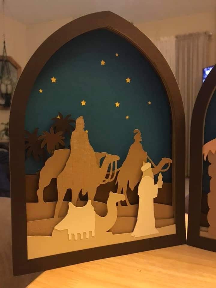 paper cut nativity scene displayed on table in living room