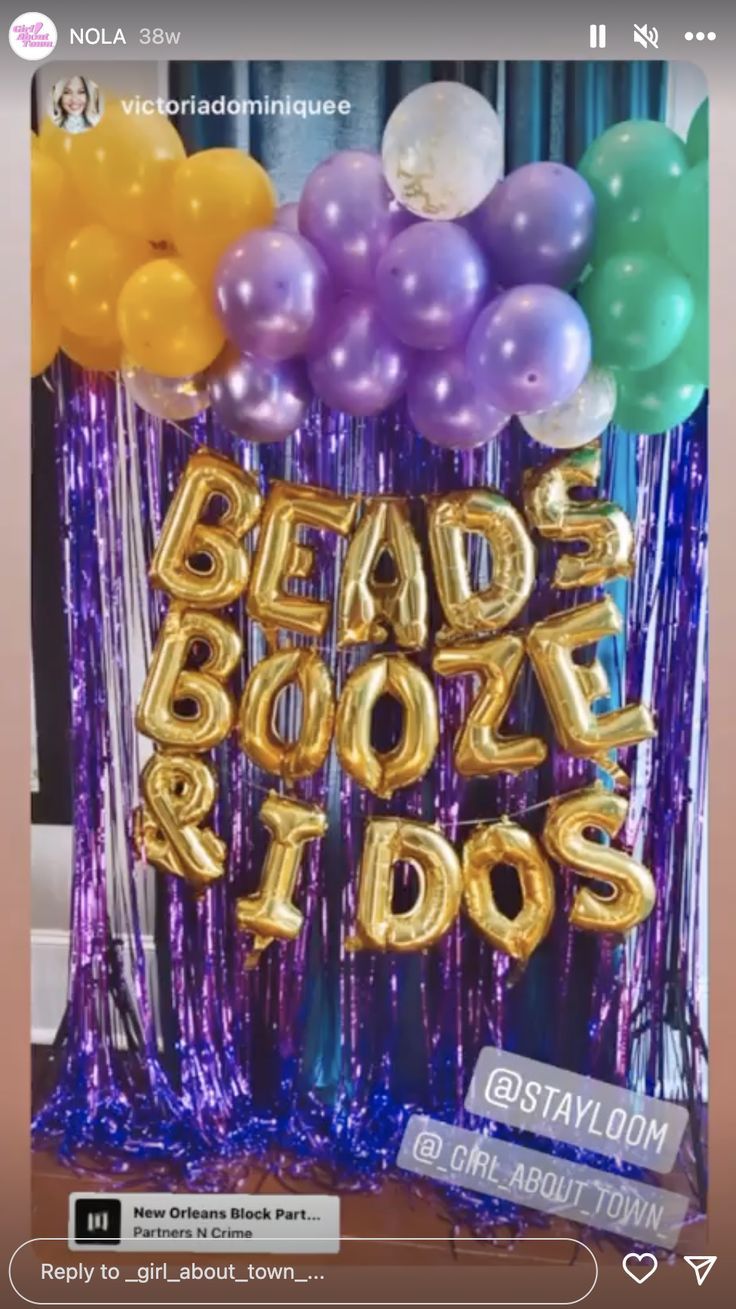 balloons and streamers in the shape of letters are on display at a birthday party