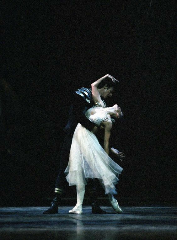 a man and woman dance together on stage