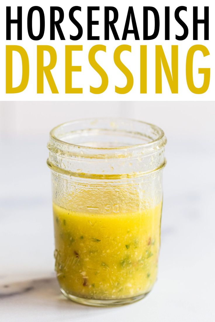 a jar filled with yellow liquid and the words horseradish dressing on it's side